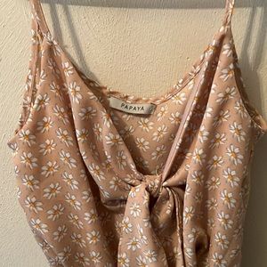 Daisyprint Adorable tie-front keyhole romper. Ruffled hem, lined in bottom half.